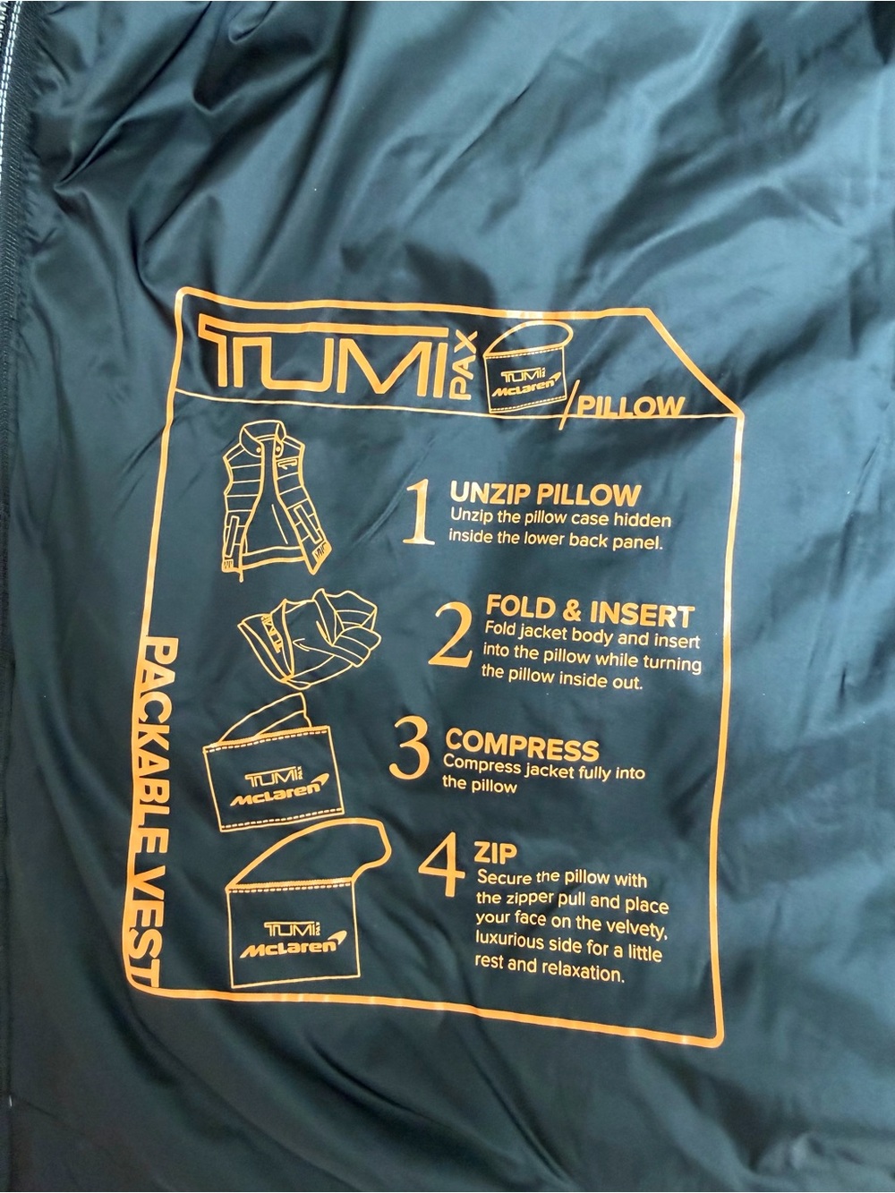 TumiPAX McLaren Packable Black Puffer Vest/Pillow with Orange Trim - Picture 10 of 12